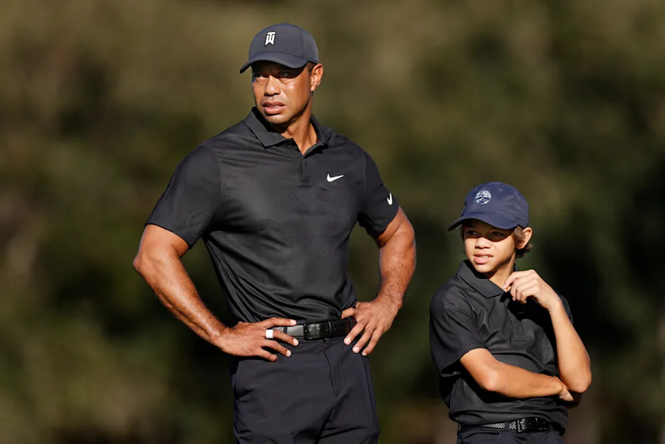 Tiger Woods and Charlie Woods look on during the Pro-Am ahead of the PNC Championship at the Ritz Carlton Golf Club Grande Lakes on December 17, 2021 in Orlando, Florida. (Photo by Douglas P. DeFelice/Getty Images)