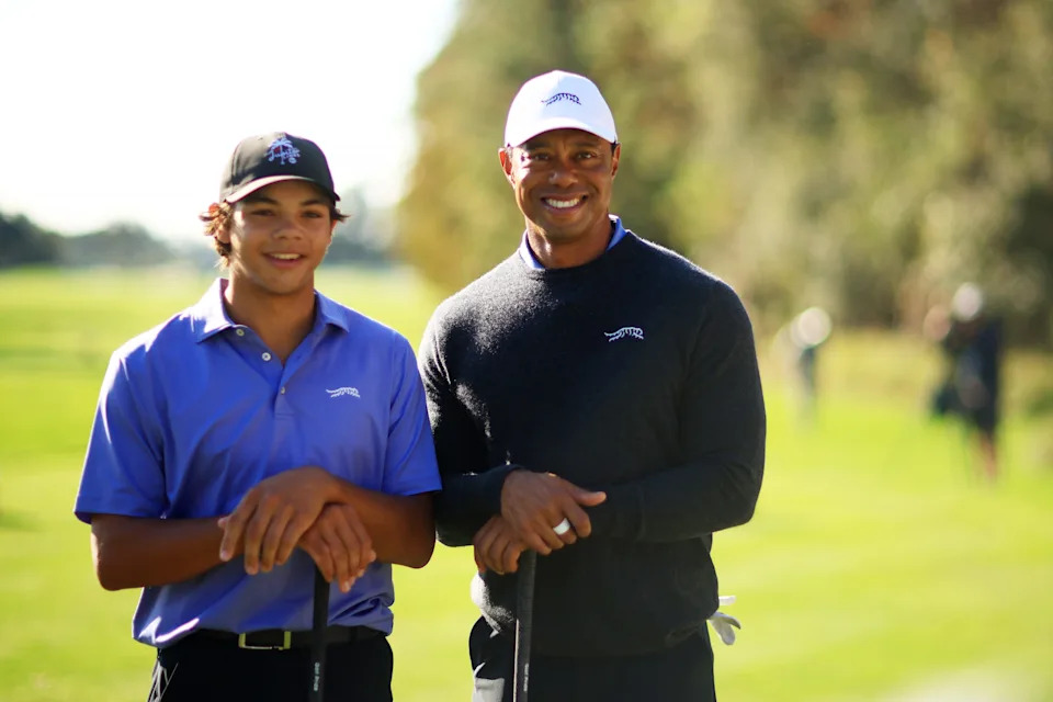 Tiger Woods and son Charlie Woods pose for a photo during the pro-am prior to the PNC Championship at Ritz-Carlton Golf Club on December 20, 2024 in Orlando, Florida.