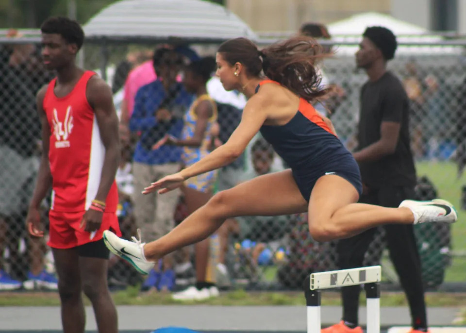 Sam Woods of Benjamin clears a hurdle in the girls 400 hurdles during the FHSAA Class 1A high school track and field championships on May 10, 2025.