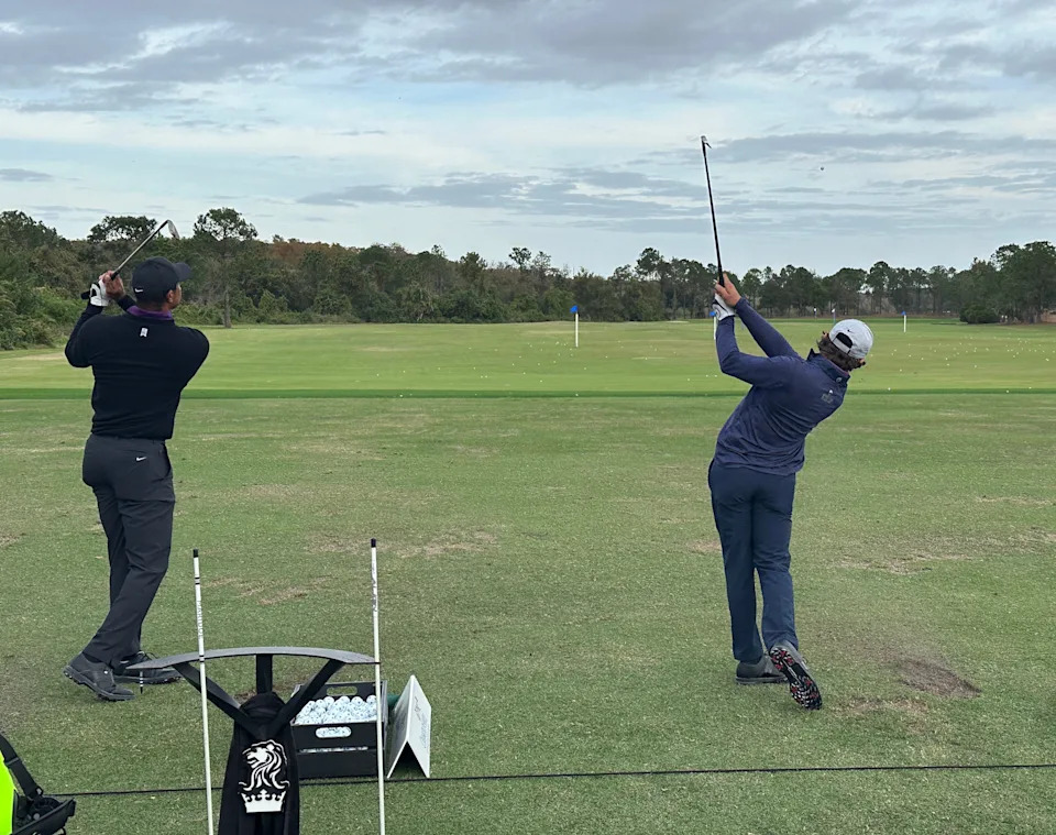 Tiger Woods and his son Charlie on the range at the 2023 PNC Championship.