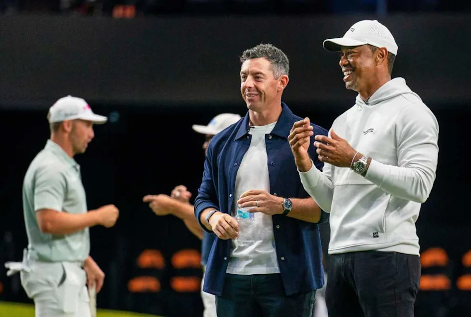 Rory McIlroy and Tiger Woods watch golfers warm up for the inaugural match at SoFi Center, the home of TGL, the interactive golf league founded by Woods and McIlroy on January 7, 2025 in Palm Beach Gardens, Florida.GREG LOVETT&sol;PALM BEACH POST &sol; USA TODAY NETWORK via Imagn Images