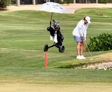 Pro golfer holes out for eagle swinging her golf club upside down