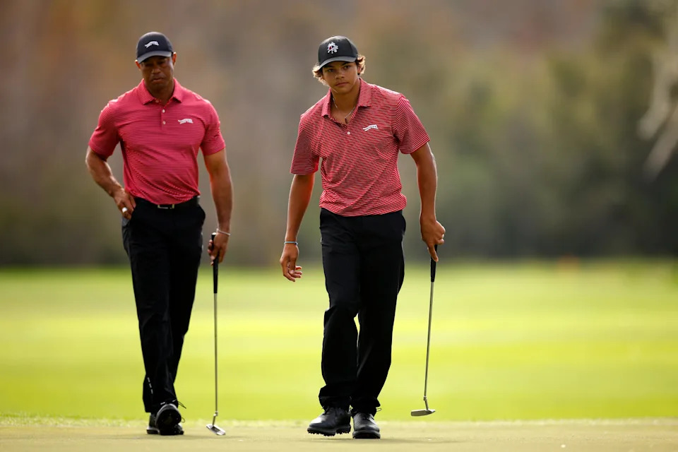 ORLANDO, FLORIDA - DECEMBER 22: Charlie Woods of the United States react to a putt on the ninth green as his father Tiger Woods of the United States looks on during the second round of the PNC Championship at Ritz-Carlton Golf Club on December 22, 2024 in Orlando, Florida. (Photo by Mike Ehrmann/Getty Images)