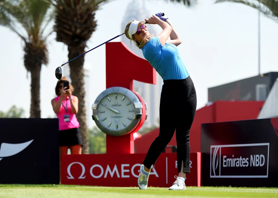 Paige Spiranac of United States tees off from the 1st hole during Day Three of the Omega Dubai Moonlight Classic at Emirates Golf Club.