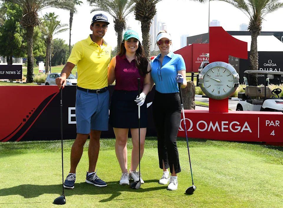 Paige Spiranac of United States, competition winner Sara Wiedenhaefer and Rafa Cabrera Bello of Spain pose for photographs.