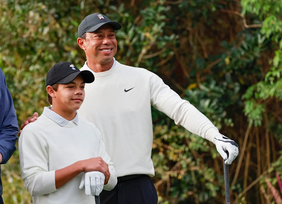 Tiger Woods and his son Charlie, left, get ready to play a pro-am round Friday before the 2022 PNC Championship.