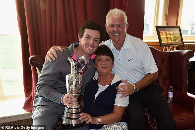 Rory McIlroy (left, pictured in 2014) has opened up on the emotional moment he saw his mum Rosie (centre) and dad Gerry (right) for the first time since his Masters victory