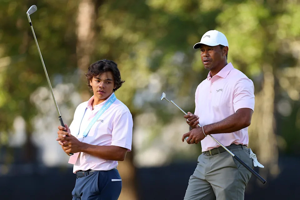 Tiger Woods of the United States and his son, Charlie Woods, look on from the second hole during a practice round prior to the U.S. Open at Pinehurst Resort on June 11, 2024 in Pinehurst, North Carolina. (Photo by Andrew Redington/Getty Images)