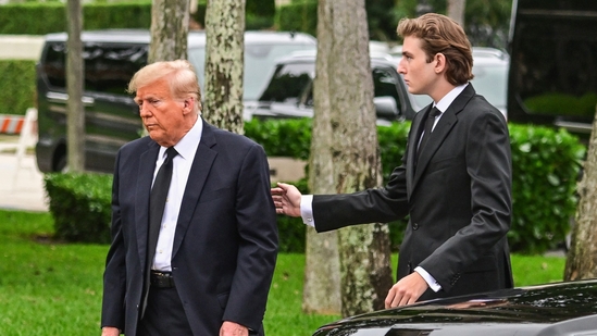 Former US President Donald Trump and his son Barron Trump attend the funeral of former first lady Melania Trump's mother Amalija Knavs, (AFP)