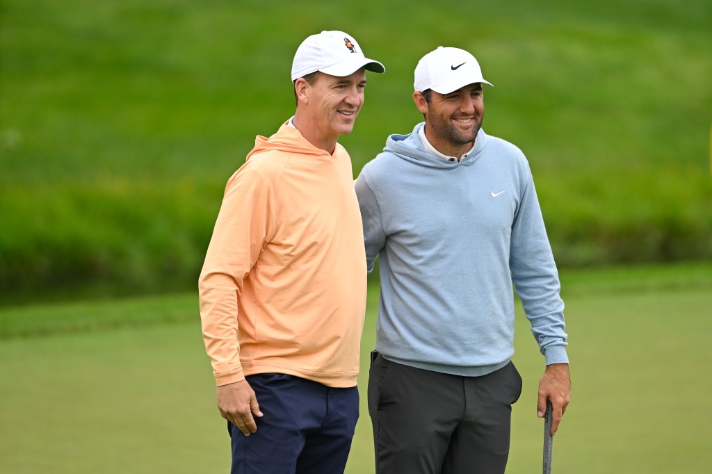 Peyton Manning, former NFL quarterback, takes a photo with Scottie Scheffler on the ninth green prior to the Memorial Tournament presentedy by Workday at Muirfield Village Golf Club on May 28, 2025 in Dublin, Ohio.