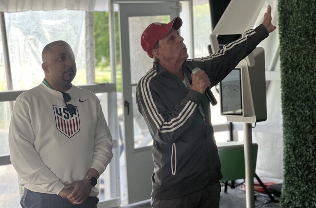 Brian Chin and Tony Travis singing the National Anthem. Photo by Wayne Daren Schneiderman