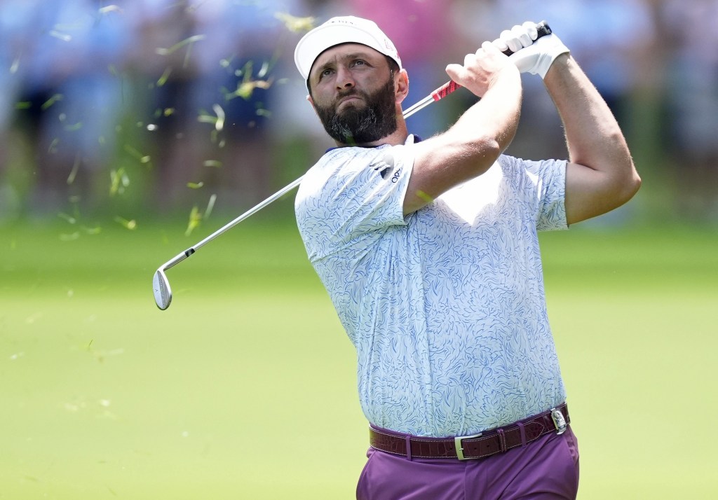 Jon Rahm hits an approach shot on the second hole during the third round of the PGA Championship on May 17, 2025.