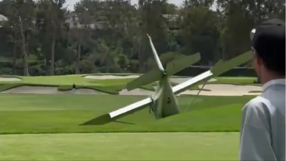 Stunned golfers watch on from the tee box