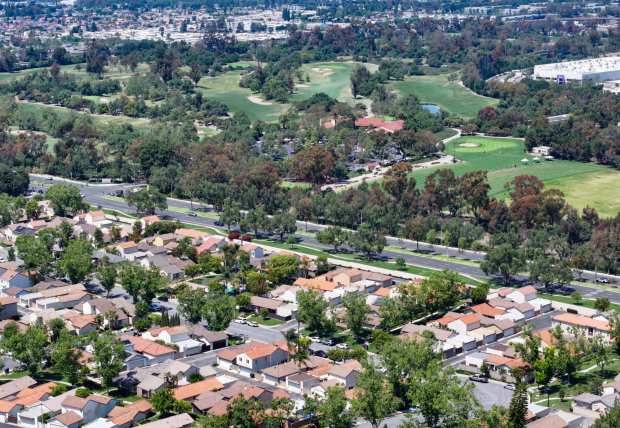Oak Creek Golf Club sits across from homes along Irvine Center Drive in Irvine, CA, on Wednesday, May 7, 2025. The Irvine Company is seeking permission from the city to build 1,500 single-family homes on the golf course. The plan would include 1,600 apartments on neighboring land previously slated for office buildings and include a new school paid for by the developer. (Photo by Jeff Gritchen, Orange County Register/SCNG)