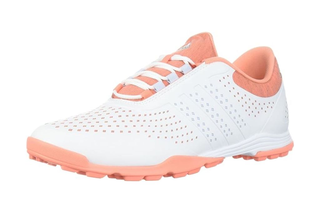 A white and pink golf shoe.