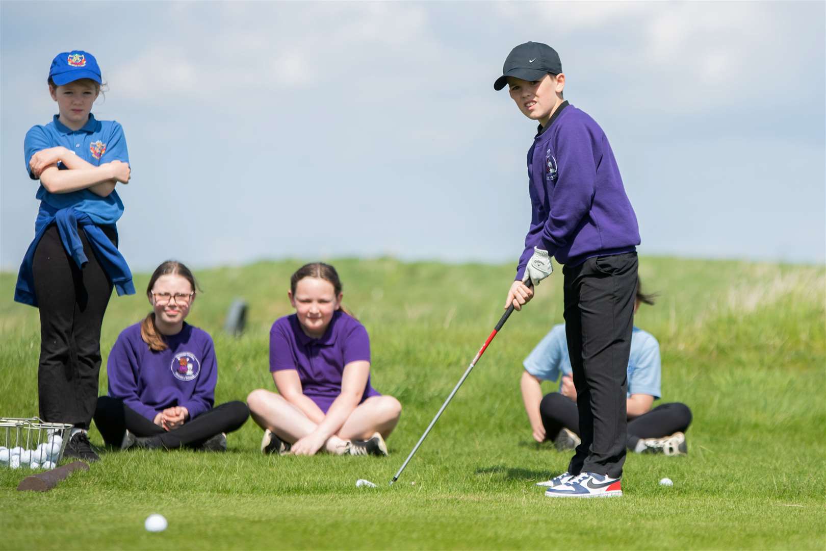 Duncan Forbes Primary School pupil chips towards the hole. Primary School's Golf Skills Challenge day at Castle Stuart Golf Course. Picture: Daniel Forsyth.