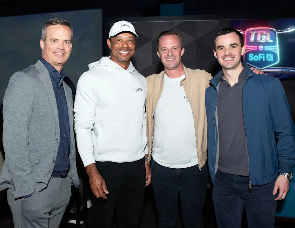 (From left) Mike McCarley, CEO and founder TMRW Sports and TGL; Tiger Woods, co-founder TMRW Sports; Michael Hamp, Middle West Partners and owner of Motor City Golf Club; Peter Hamp, Middle West Partners and owner of Motor City Golf Club. TGL PHOTO/SPECIAL TO THE POST
