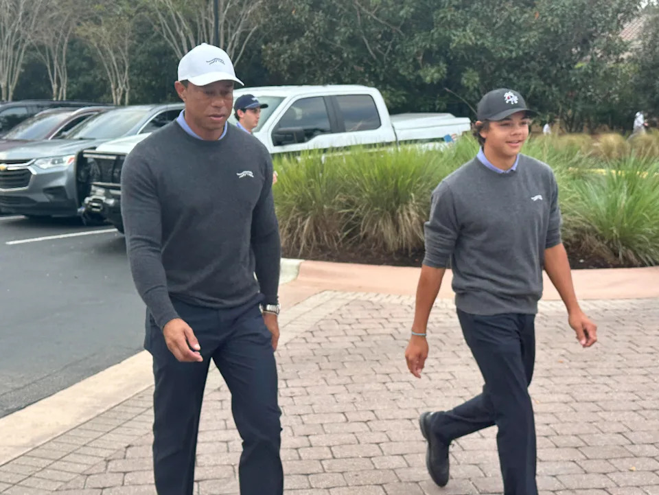 Tiger Woods and his son, Charlie arrive at the PNC Championship in Orlando, Florida.