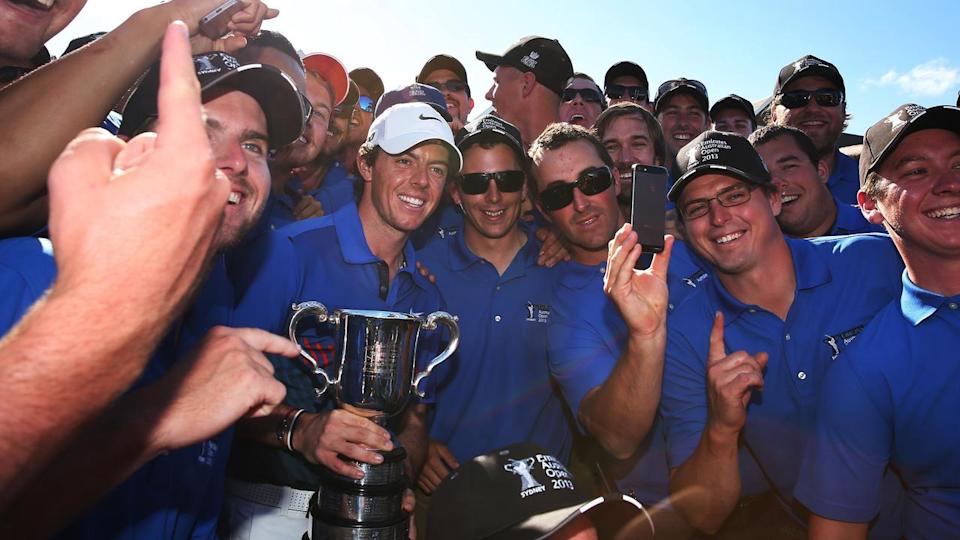 Rory McIlroy of Ireland with the Stonehaven Cup and ground staff winner of the 2013 Emirates Australian Open Golf Championship at Royal Sydney Golf Course. pic. Phil Hillyard