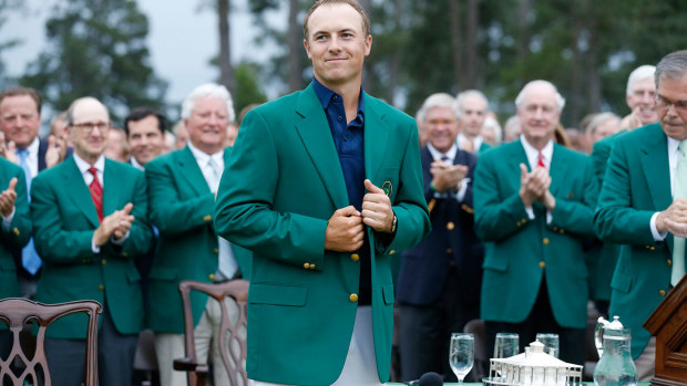 Jordan Spieth dons the green jacket after winning the 2015 Masters.