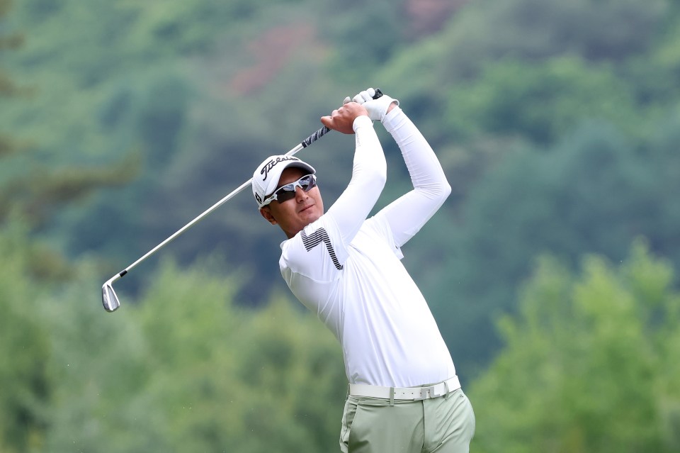 Sadom Kaewkanjana of Thailand hitting a golf ball.