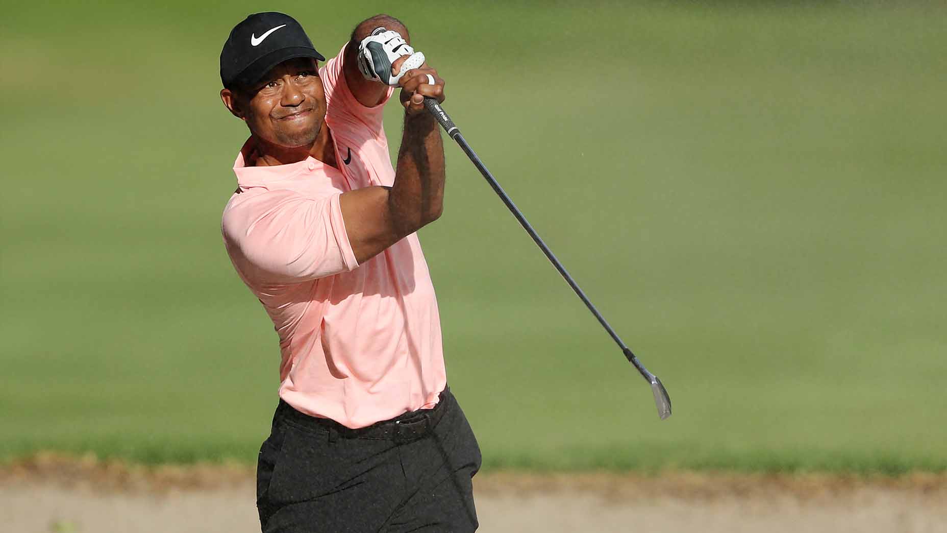 Tiger Woods hits a shot out of the bunker during the 2019 WGC-Mexico Championship.