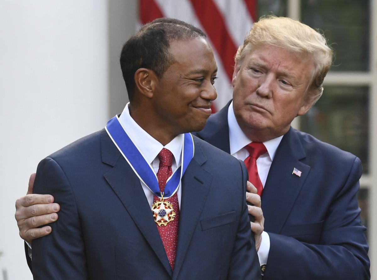 US President Donald Trump presents US golfer 