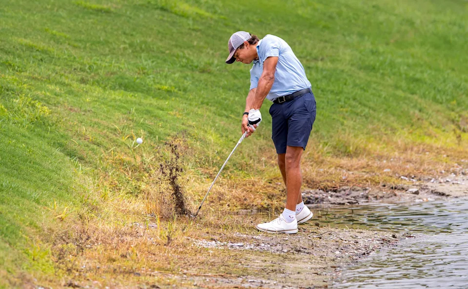 Charlie Woods hits the ball out of the mud during the first round of the108th Amateur Championship at BallenIsles Country Club on June 5, 2025, in Palm Beach Gardens, Florida.