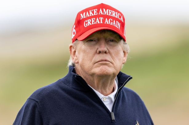 Donald Trump wearing a Make America Great Again hat at Turnberry