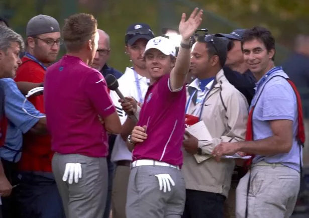 Shipnuck (right) interviews Ian Poulter and McIlroy during the 2012 Ryder Cup at Medinah