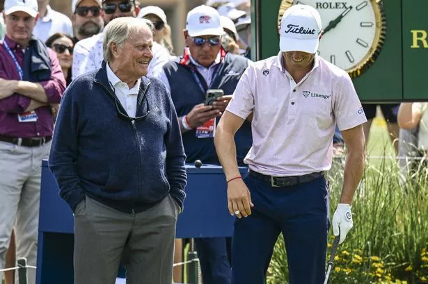 Jack Nicklaus smiles with Justin Thomas.