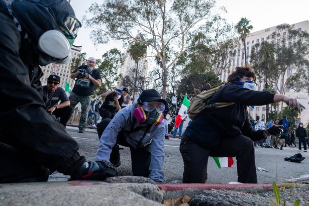 Protesters clash with law enforcement in the streets of LA