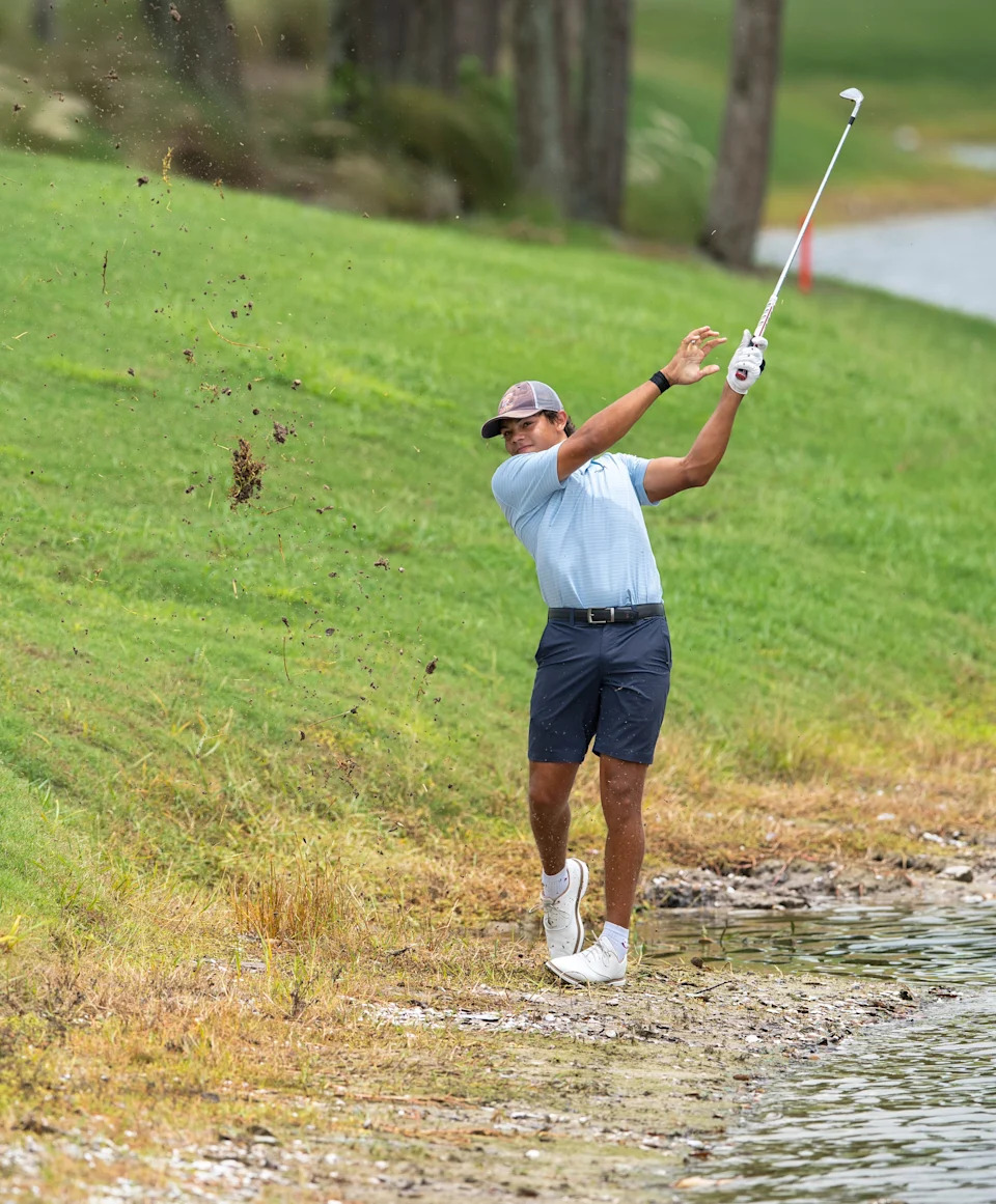 Charlie Woods hits the ball out of the mud during the first round of the108th Amateur Championship at BallenIsles Country Club on June 5, 2025, in Palm Beach Gardens, Florida.