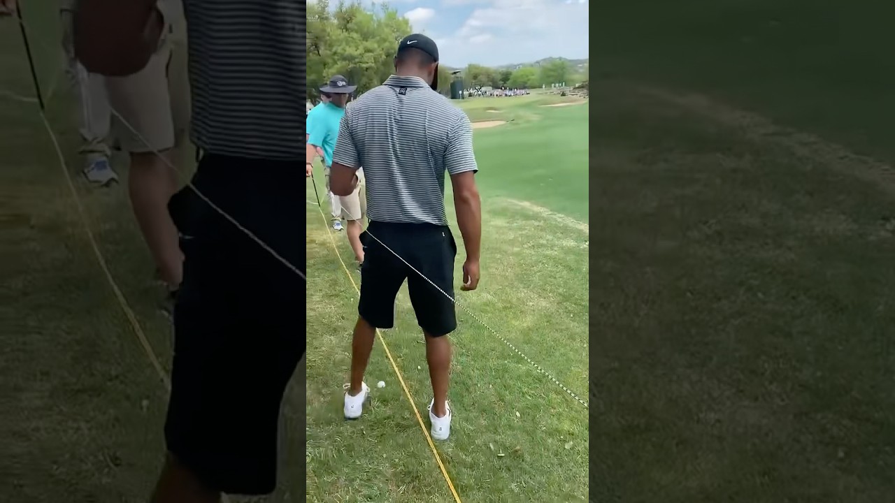 Tiger Woods breaks out the foot wedge Tiger Woods breaks out the foot wedge