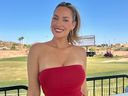 Paige Spiranac poses for a photo at an Arizona golf course.