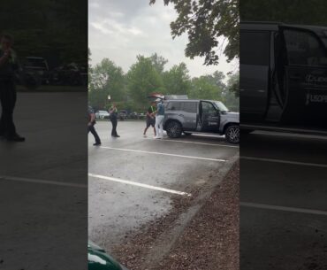 Phil Mickelson missed the cut but still made time in the rain to hand out gifts to the officers