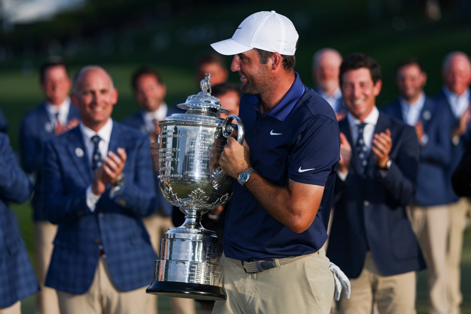 Scottie Scheffler holding the Wanamaker Trophy after winning the PGA Championship.
