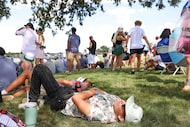 Crowd take shelter from the sun under a tree during the second day of LIV Golf Dallas, on...