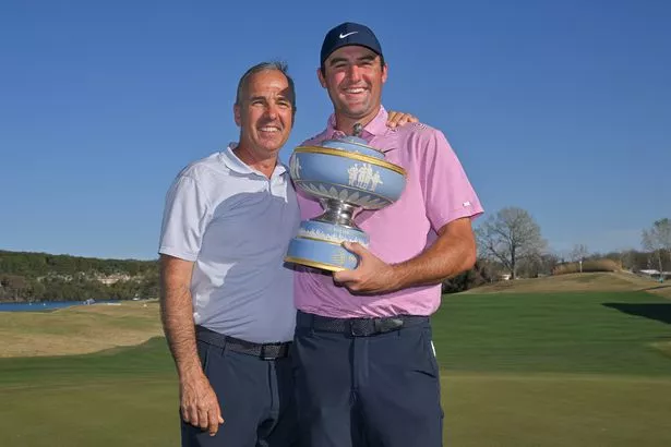 Scottie Scheffler poses with his Dad, Scott, after winning the 2022 World Golf Championships-Dell Technologies Match Play