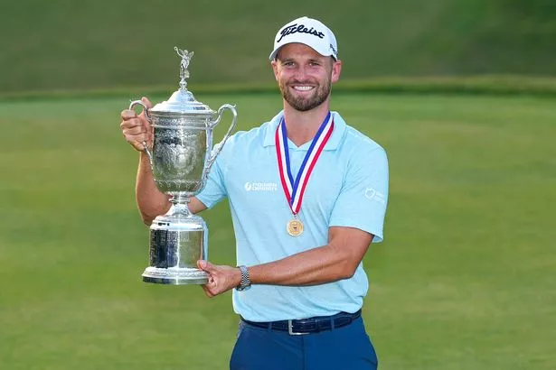 Wyndham Clark holds the trophy after winning after the US Open  at Los Angeles Country Club 