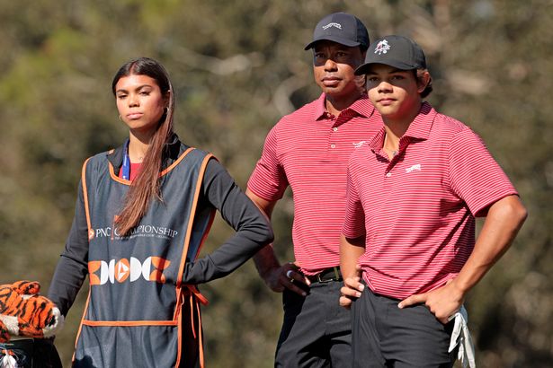 Tiger Woods of the United States with his son Charlie Woods and daughter Sam Woods prepare to tee off from the second tee during the second round of the PNC Championship at Ritz-Carlton Golf Club on December 22, 2024 in Orlando, Florida