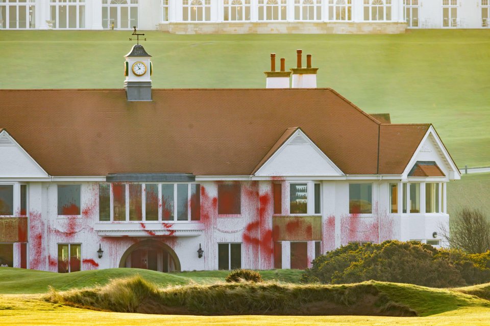 Red paint splattered on a clubhouse.
