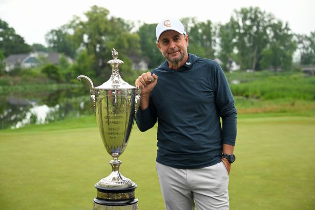 Richard Bland posing with his Senior PGA Championship title