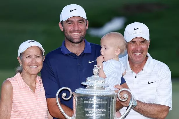 Scottie Scheffler celebrates winning the PGA Championship with his son, Bennett, and his parents, Diane and Scott