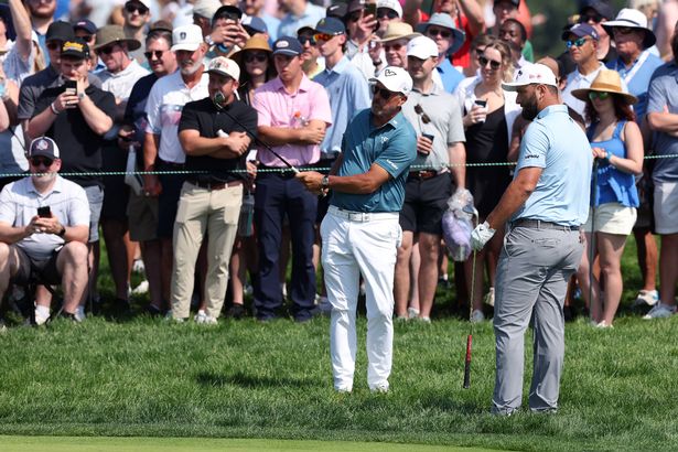 Phil Mickelson plays a golf shot