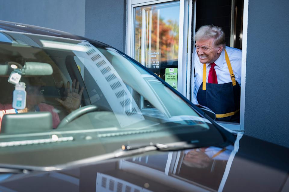 President Donald Trump hands out food while standing at a drive-thru window during a campaign stop at a McDonald's in Feasterville-Trevose, PA on Sunday, Oct. 20, 2024. / Jabin Botsford/The Washington Post via Getty Images