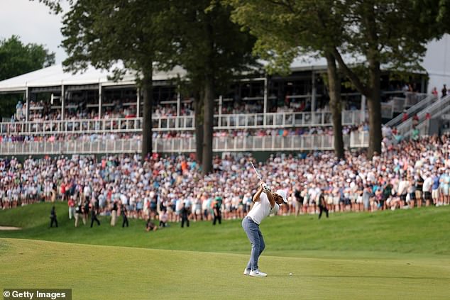 The Englishman's second shot (above) missed the green and his par putt missed to the right