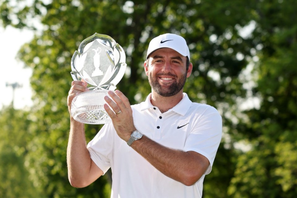 DUBLIN, OHIO - JUNE 01: Scottie Scheffler of the United States poses with the trophy after winning the Memorial Tournament presented by Workday 2025 at Muirfield Village Golf Club on June 01, 2025 in Dublin, Ohio. (Photo by Michael Reaves/Getty Images)