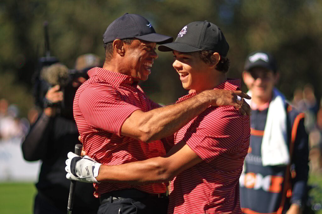 Tiger Woods celebrates Charlie Woods making a hole in one during the PNC Championship