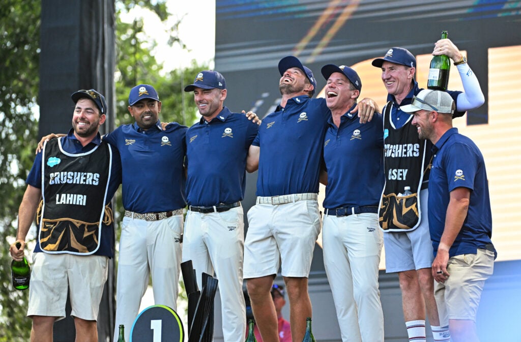 Anirban Lahiri (left), Charles Howell III (center left), Bryson DeChambeau (center right) and Paul Casey (right) of Crushers GC celebrate after winning LIV Golf Dallas